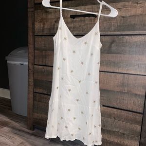 White dress with gold stars. selling for $20. size small.